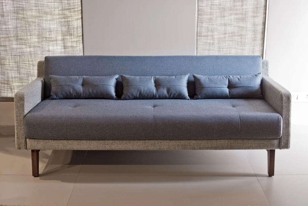 Close-up view of the dual fabric sofa upholstery and stitching details