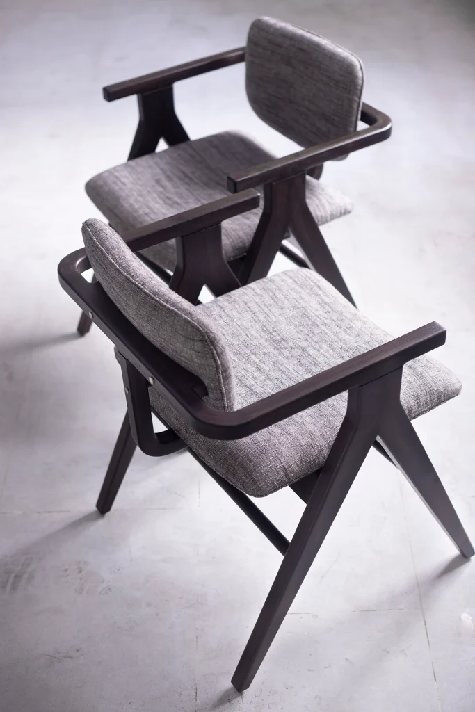 Side view of handcrafted dining chair showcasing ergonomic design