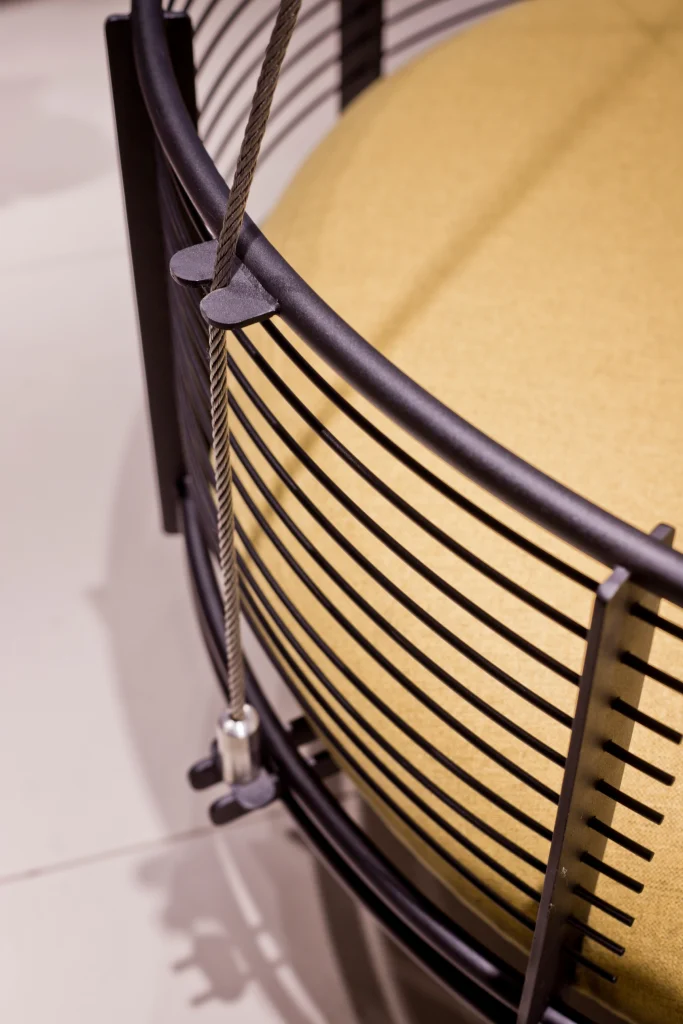 Handcrafted wooden circular swing installed in a living space