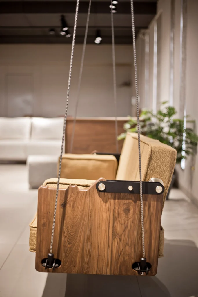 Maitree indoor wooden swing installed in living space