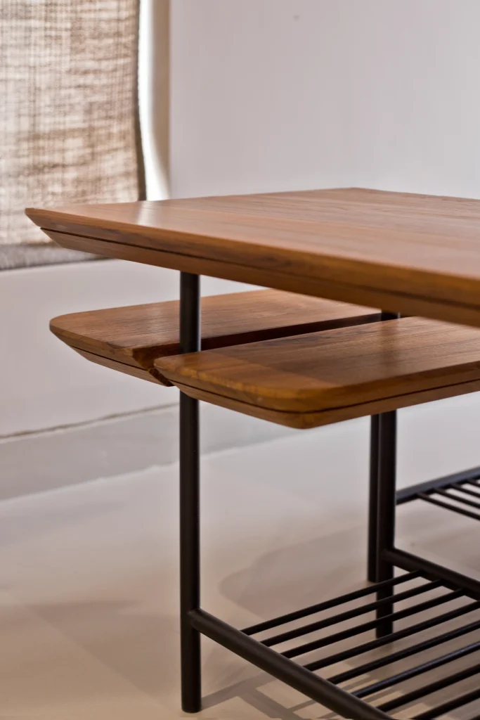 Nested wooden tables stacked together