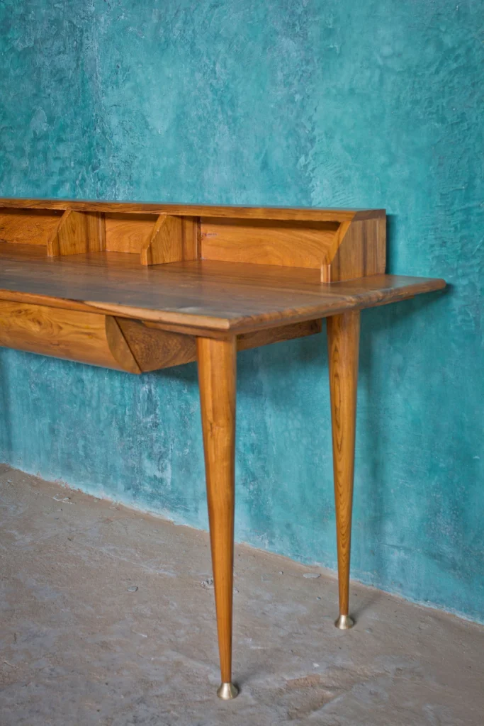 Angle shot of work desk with capped legs furniture
